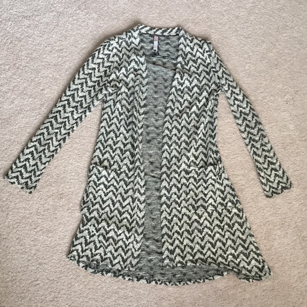 *Wifes closet. Long sleeved, open sweater; S.